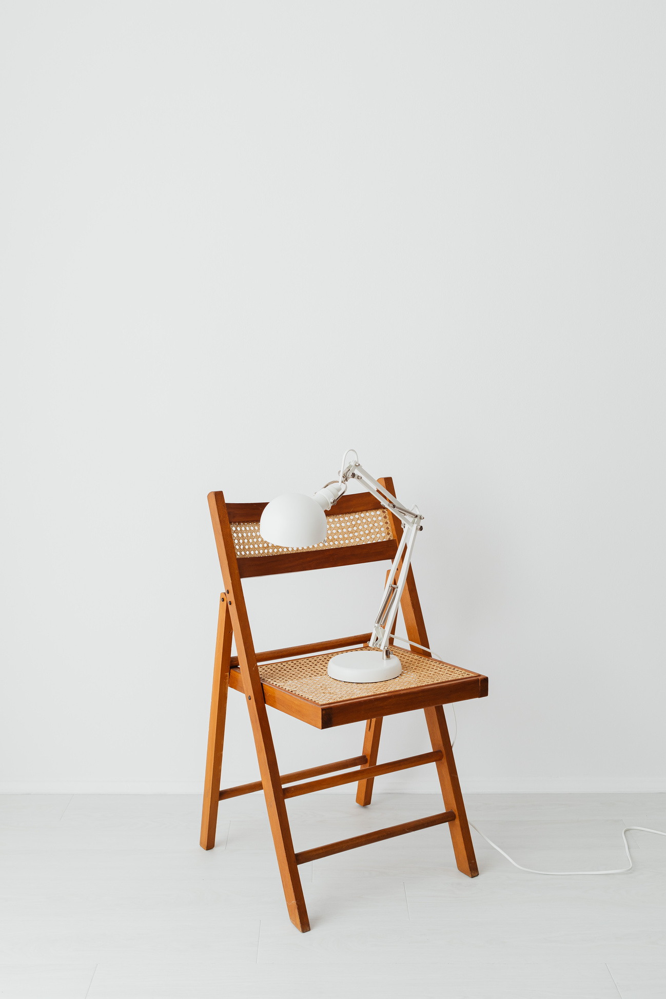 a wooden chair with a lamp on it, as a symbol about company